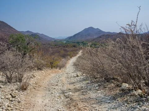 Rough offroad track with large ruts along Kunene River between Kunene River Stock Photos