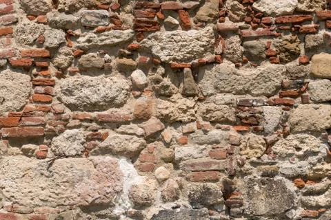 Rough old brick and stone wall texture Stock Photos