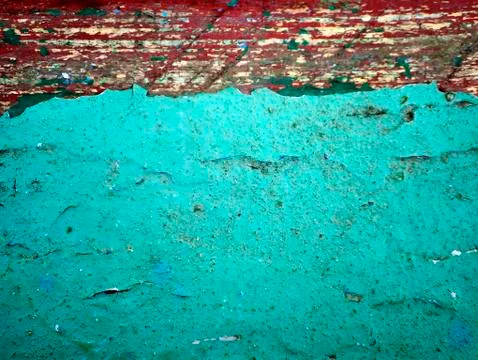 Rough old wall texture of red and blue-green color Stock Photos