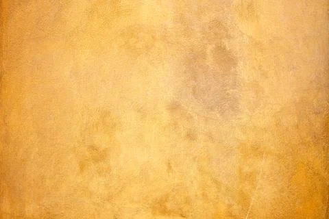 Rough orangyish plastered wall with tiny cracks Stock Photos