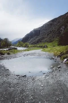 Rough path with puddle of water in a mountainous environment, Cattle Flat, Stock Photos