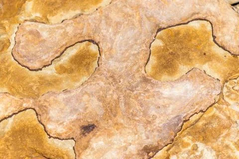 Rough peach and rust colored crystal textured rock background Stock Photos