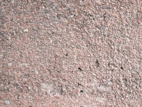 Rough pink pebble stone aggregate wall surface texture background Stock Photos