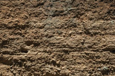 Rough plaster on an old wall forming a quaint background at Caceres Stock Photos