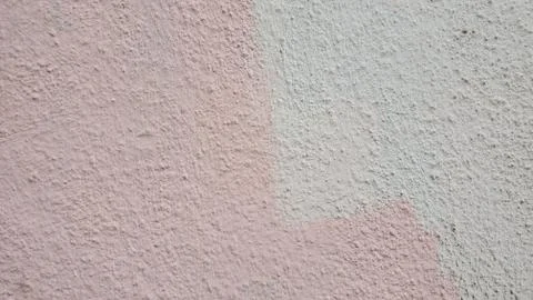 Rough plaster wall surface closeup. Pink stucco texture Foto stock