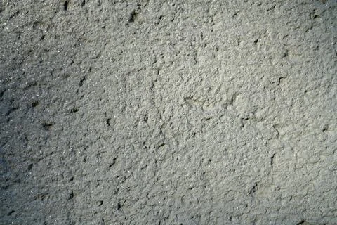 Rough plaster wall texture with fine granular surface Stock Photos