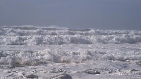 Rough, powerful white waves on the stormy ocean. Slow motion. Stock Footage 148394084