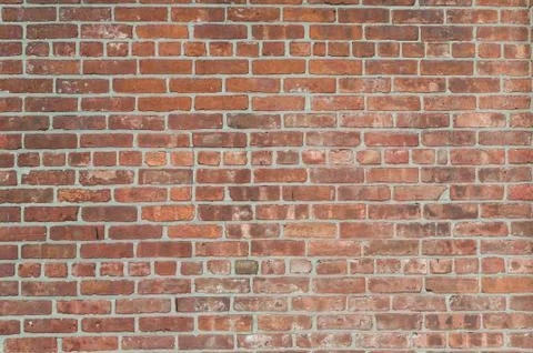 Rough red brick wall background Stock Photos