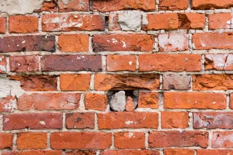 Rough red brick wall as background texture Foto stock