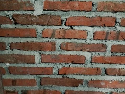 Rough Red Brick Wall Texture with Wide Gray Mortar Joints Stock Photos