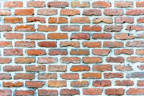 Rough red brickwall Stock Photos