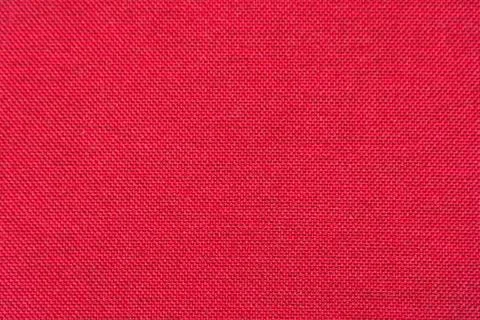 Rough red fabric texture for background and design Foto stock