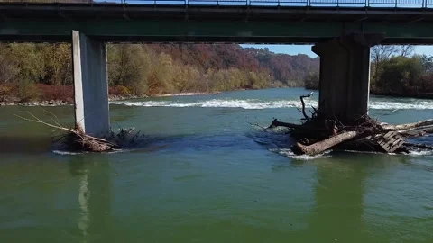 Rough river flying under the bridge over water Stock Footage 142542437
