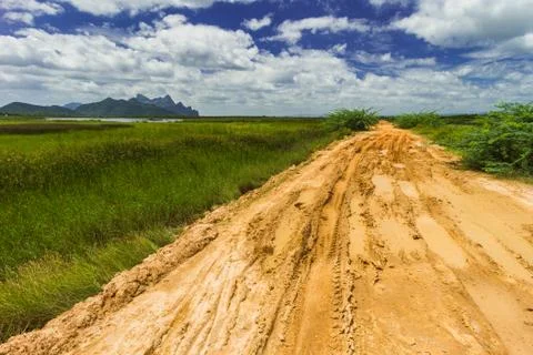 Rough road in countryside Stock Photos