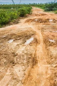 Rough road in countryside Stock Photos