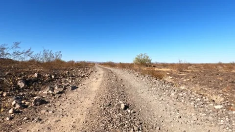 Rough road with rocky bends and large stones littering the way Stock Footage 147243398