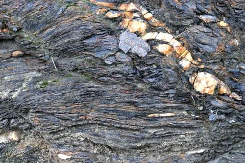 Rough rock layers texture. Mountain pattern background. Stock Photos