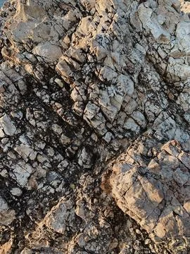 Rough rock surface texture. Rock background pattern. Stock Photos