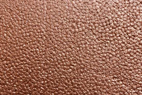 Rough rose gold surface as background, top view Stock Photos