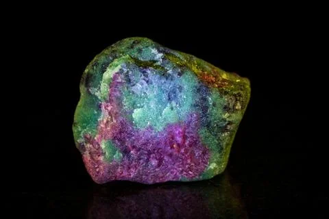 Rough ruby with zoisite in front of black Stock Photos