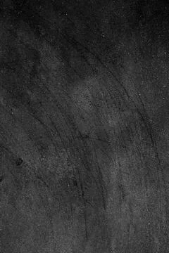 Rough sand texture with black scratch lines on a dark cement plaster wall Stock Photos