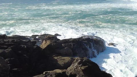 Rough sea beating against the rocks and generating foam Stock Footage 170201498