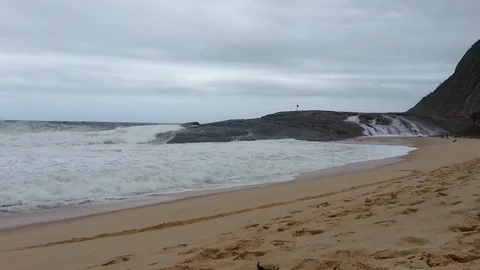 Rough sea. Strong waves crushing Pampo Rock. Itacoatiara Beach, Rio de Janeir Stock Footage 121597290