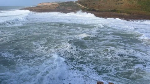 Rough sea with waves breaking against rocks Stock Footage 254361878