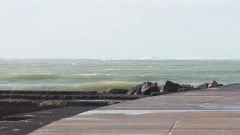 Rough sea waves crashing against a pier Stock Footage 327594853