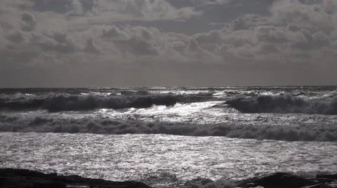 Rough sea with waves crashing at sunset in France Stock Footage 61552997