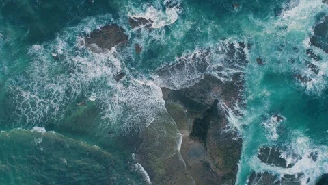 Rough sea waves hitting rocks slow motion capture an aerial view Stock Footage 92050929