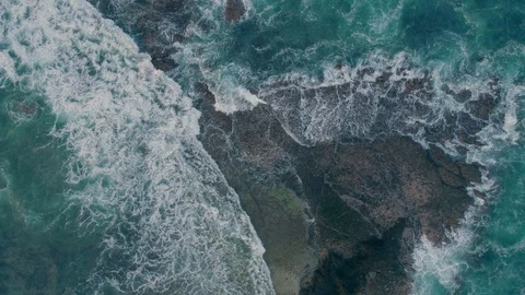 Rough sea waves hitting rocks slow motion capture an aerial view Stock Footage 92051783