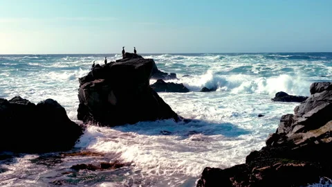 Rough seas break across rocks outside of Pebble Beach, California Stock Footage 230330718