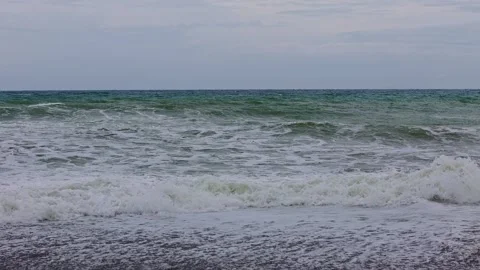 Rough seas during low pressure area in the Philipines with waves on the beach Stock Footage 313526360