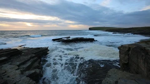 Rough seas looking towards kitchener's memorial in Orkney in HD Stock Footage 298000363