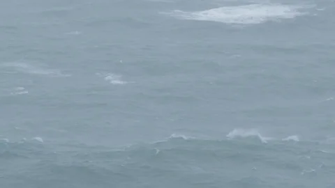 ROUGH SEAS ROLLING WAVES ON A RAINY DAY Stock Footage 81687296