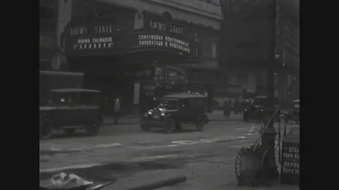 Rough shots of New York city in 1920s well as parades of cars and trucks in Stock Footage