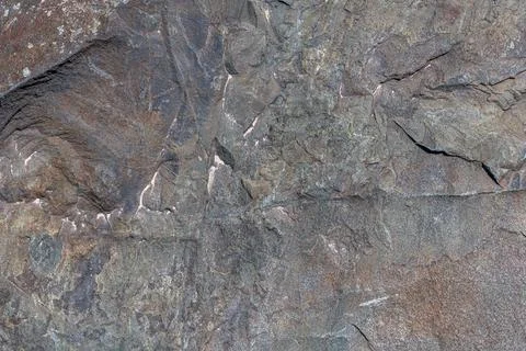 Rough solid sedimentary rock face texture and background Stock Photos