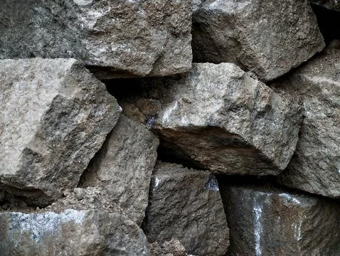 Rough stacked limestone blocks with textured mortar Stock Photos