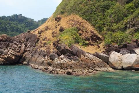 Rough stone on island Stock Photos