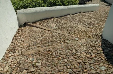 Rough stone pavement in a pathway made of large stairs Stock Photos