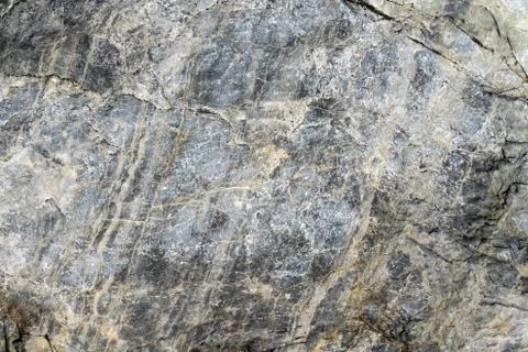 Rough stone surface grey color. Detailed nature background or pattern texture Stock Photos
