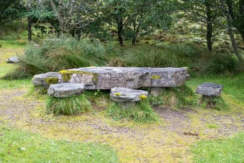 Rough stone table and chairs at parking of Knockan Crag in North West Highlan Stock Photos
