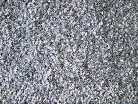 Rough stone texture with dots and depressions. Grainy background with groov.. Stock Photos