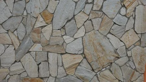 Rough stone tiled wall texture Stock Photos