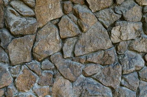 Rough stone wall background Stock Photos