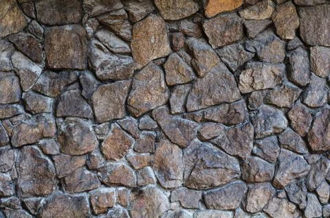 Rough stone wall background Stock Photos