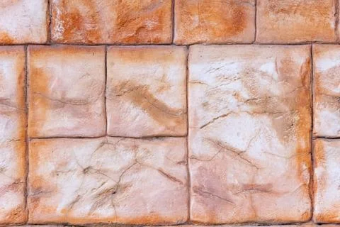 Rough stone wall blocks showing natural patterns and aged texture, forming .. Stock Photos