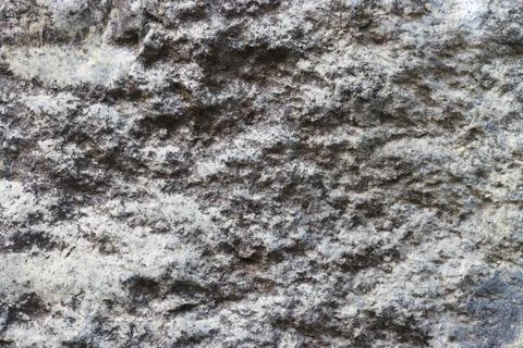 Rough stone wall close up. Stock Photos