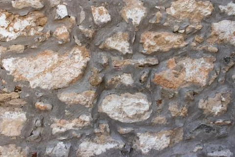 Rough stone wall texture with big rocks Stock Photos